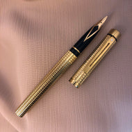 Sheaffer Targa, 1011 diamond squares gold electroplated pattern.